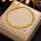 Seraphina Double-Layer Gold-Tone Charm Anklet – Heart, Butterfly, Shell & Pearl Details