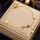 Seraphina Double-Layer Gold-Tone Charm Anklet – Heart, Butterfly, Shell & Pearl Details