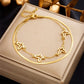 Seraphina Double-Layer Gold-Tone Charm Anklet – Heart, Butterfly, Shell & Pearl Details