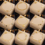 Seraphina Double-Layer Gold-Tone Charm Anklet – Heart, Butterfly, Shell & Pearl Details